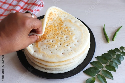 Soft & Spongy Malvani Amboli. It is a typical Konkani preparation made with rice and Urad dal or black lentil  fermented batter. Soft Dosa or plain uttapam. Best to combine with fish curry. Copy Space photo