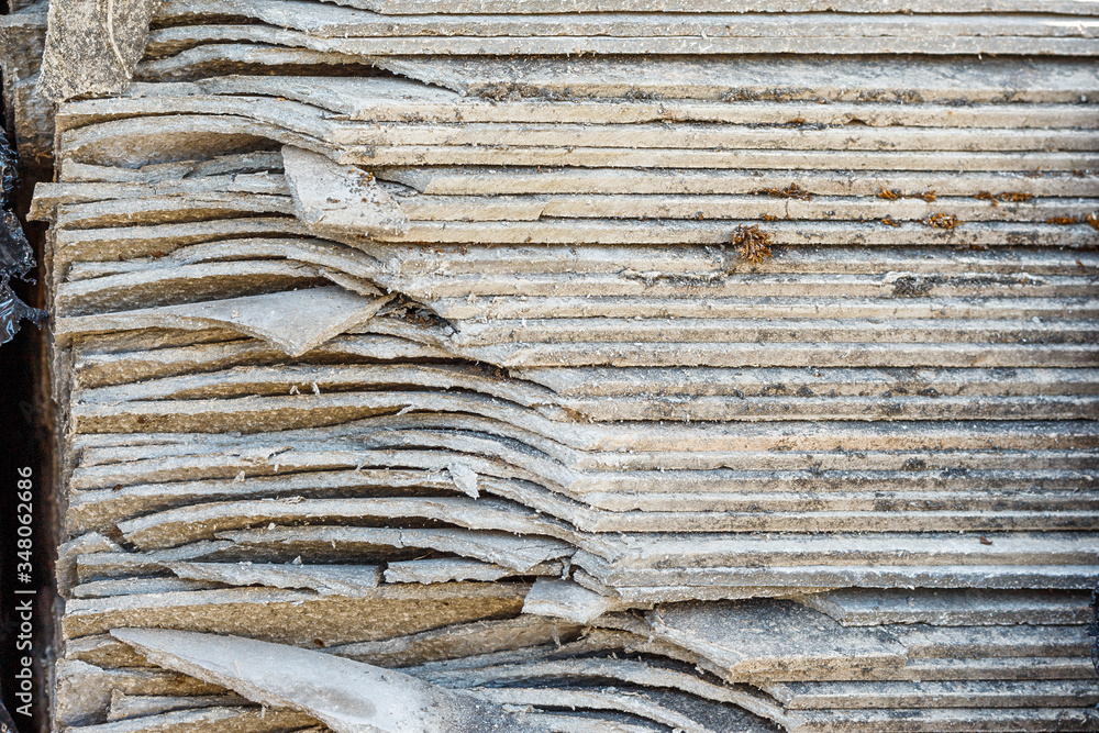 Asbestos landfill . Roof covering material with asbestos fiber
