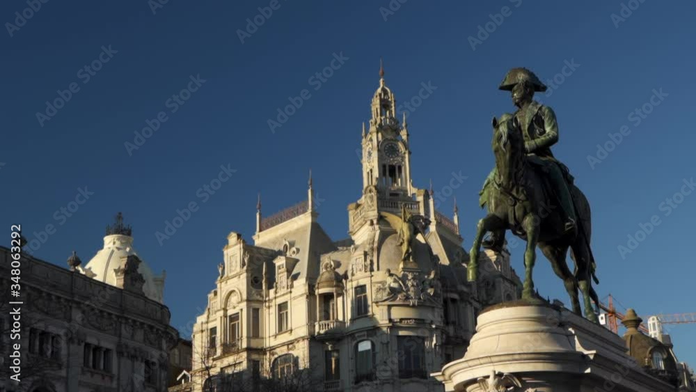 Traditional Portuguese Building next to Statue of Guy with Horse, Handheld Traditional Portuguese Building next to Statue of Guy with Horse, Handheld