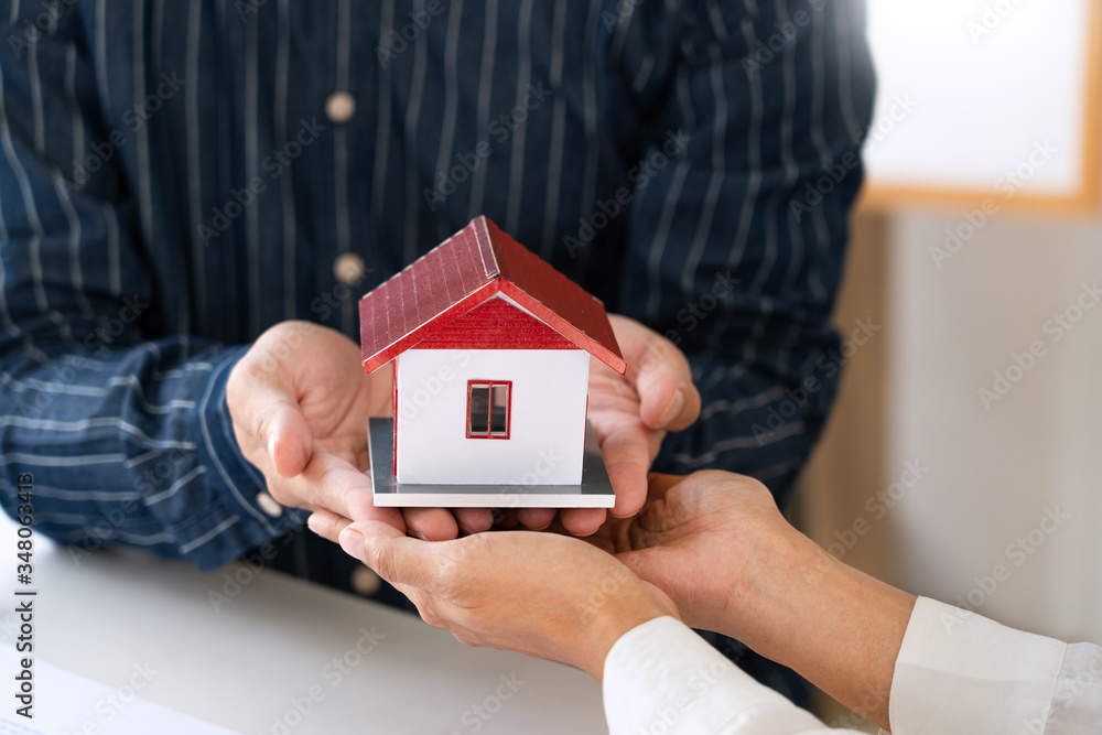 estate agent giving house keys customer sign agreement property for sale, Buying and selling homes concept estate agent giving house keys customer sign agreement property for sale, Buying and selling homes concept