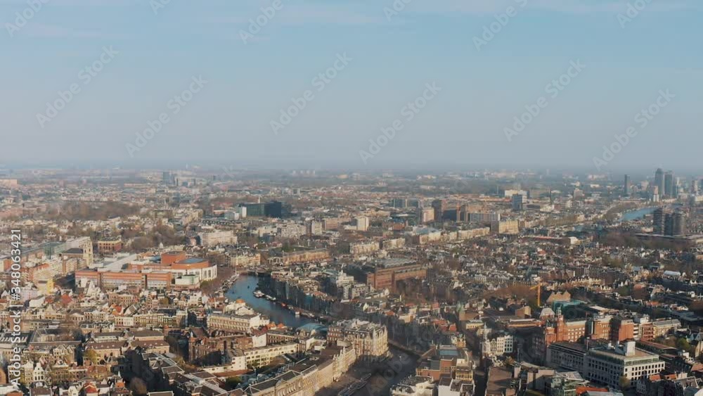 Aerial view over Amsterdam, central station and the canals Aerial view over Amsterdam, central station and the canals