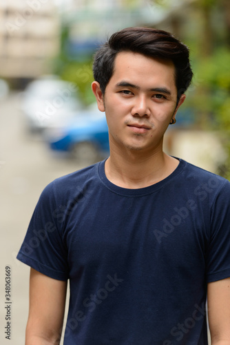 Portrait of young Asian man in the streets