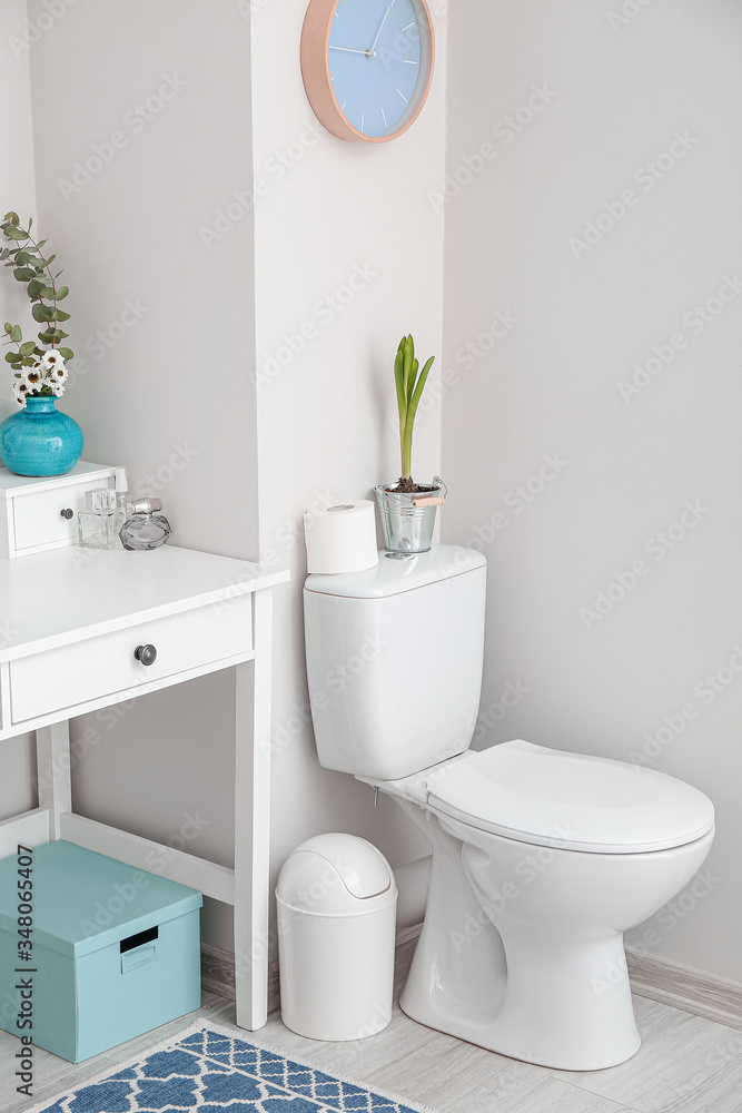 Interior of bathroom with floral decor Interior of bathroom with floral decor