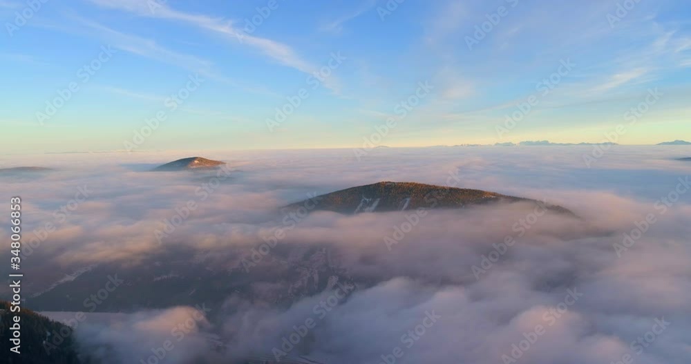Aerial shot of beautiful cloudscape over snowcapped mountains against blue sky - Falkert, Austria Aerial shot of beautiful cloudscape over snowcapped mountains against blue sky - Falkert, Austria