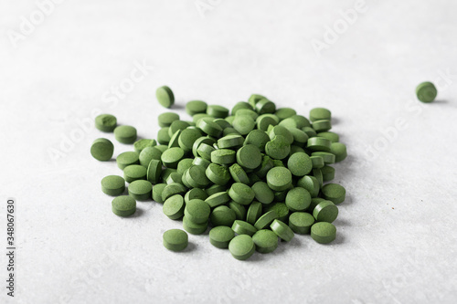 Green chlorella pills. Concept of superfood and detox. 