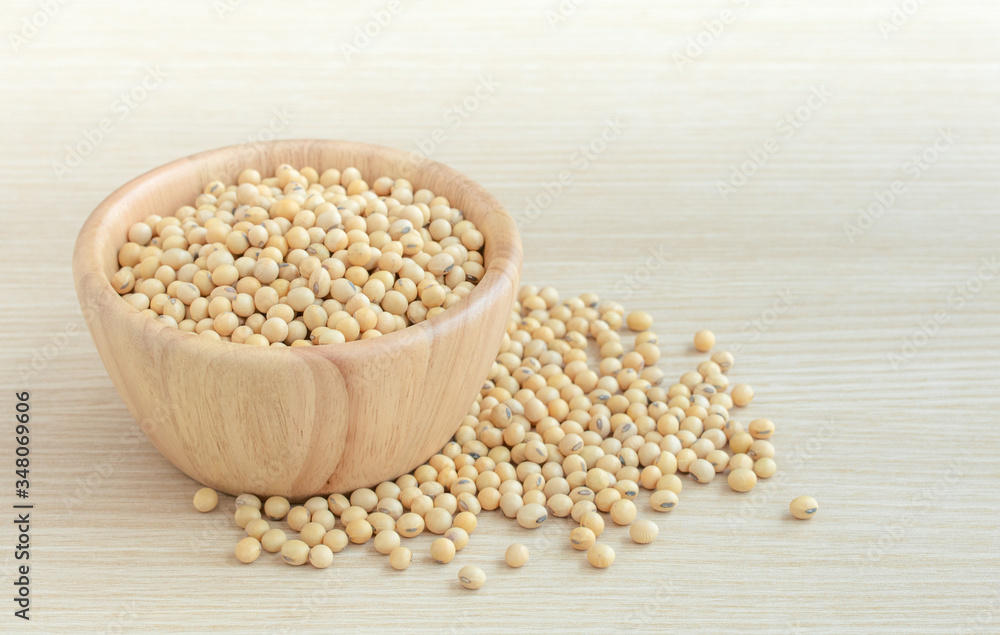 Soy bean in wood bowl on wooden table. Soy bean in wood bowl on wooden table.