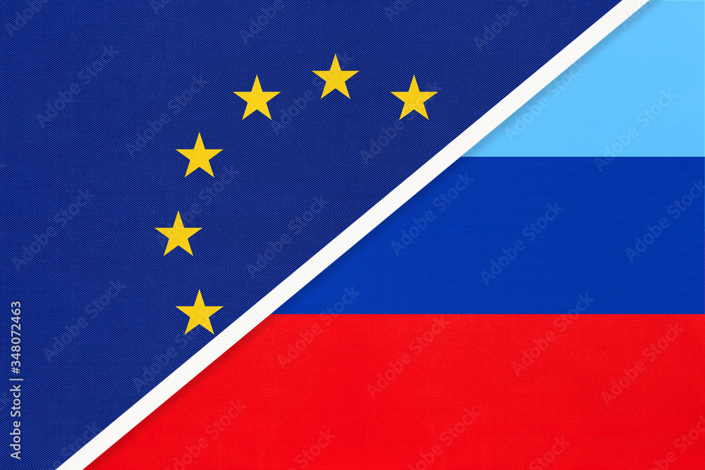 European Union or EU vs Luhansk Republic national flag from textile. Symbol of the Council of Europe association. European Union or EU vs Luhansk Republic national flag from textile. Symbol of the Council of Europe association.