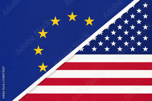 European Union or EU vs USA national flag from textile. Symbol of the Council of Europe association.