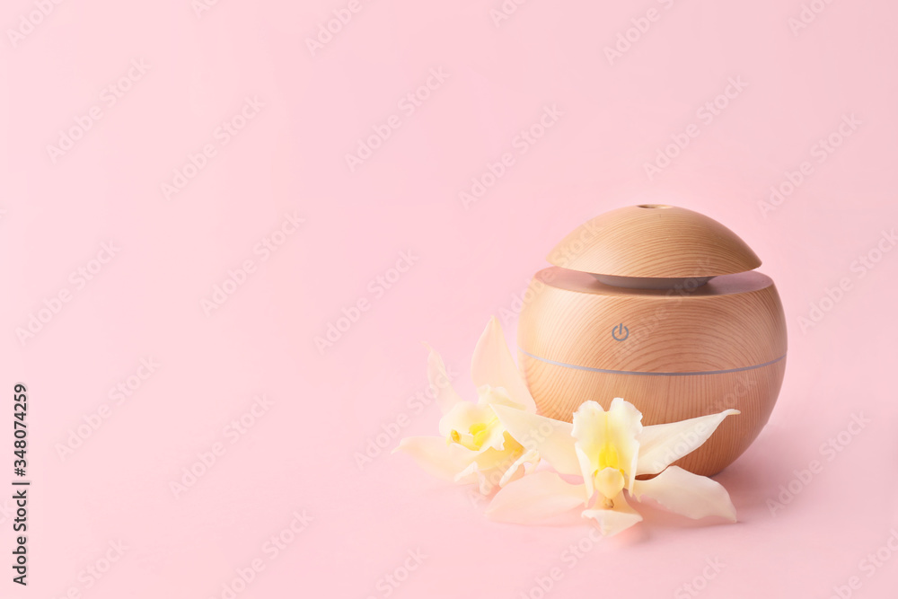 Aroma oil diffuser on color background Aroma oil diffuser on color background