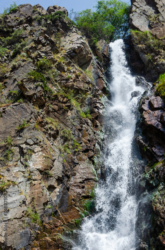 Rocky mountains waterfall in the afternoon short exposure flash Rocky mountains waterfall in the afternoon short exposure flash