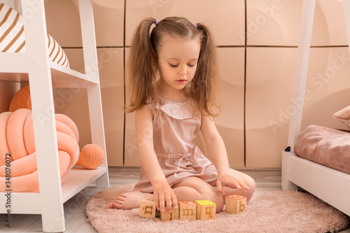 Little girl playing at home