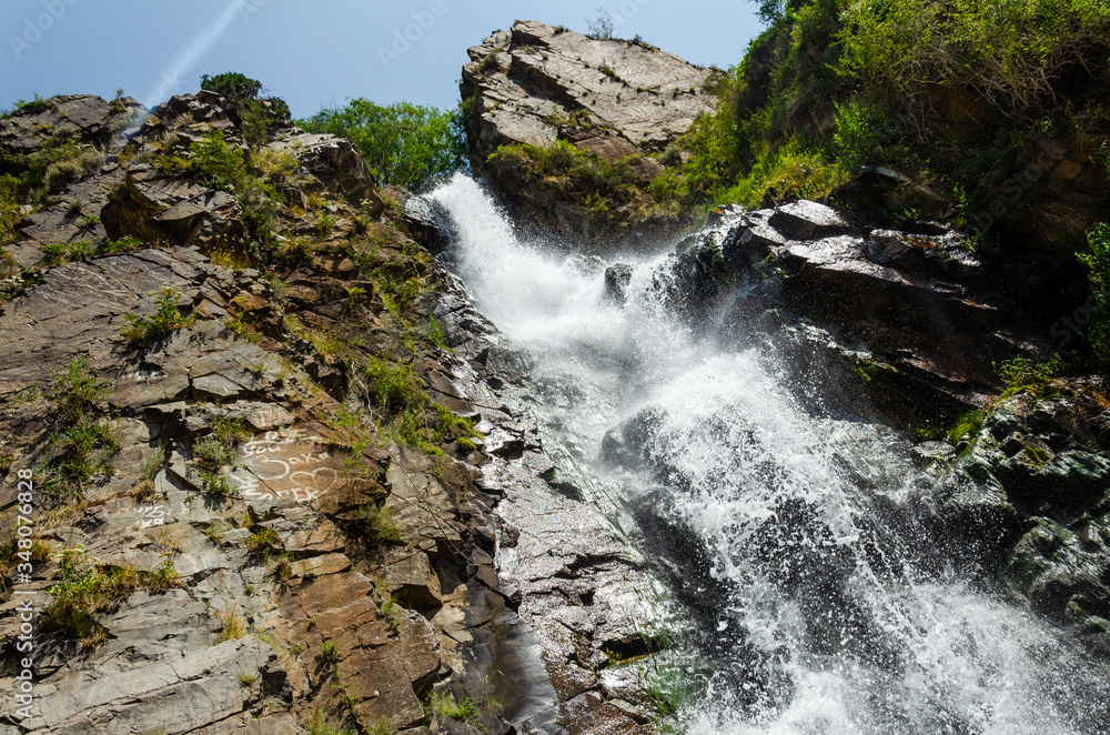 Rocky mountains waterfall in the afternoon short exposure flash