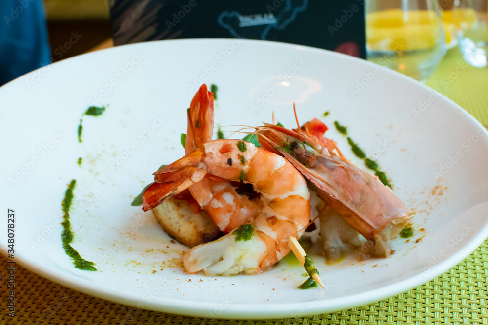Shrimp, bruschetta with tomatoes, garlic and fresh basil Shrimp, bruschetta with tomatoes, garlic and fresh basil