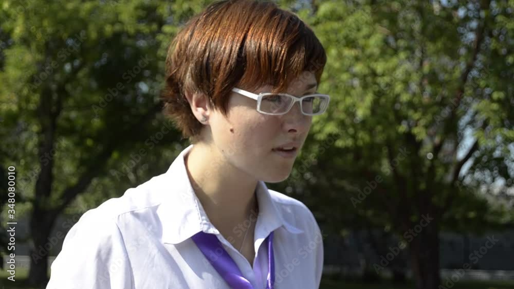 Young businesswoman working in a park on a sunny summer day Young businesswoman working in a park on a sunny summer day