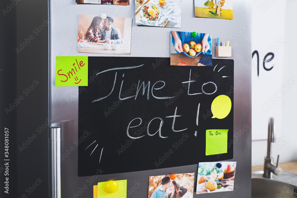 Obraz premium Chalkboard on door of refrigerator in kitchen