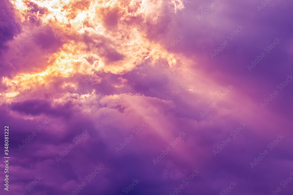 Overcast dark purple sky with orange yellow sun beam light from heaven Overcast dark purple sky with orange yellow sun beam light from heaven