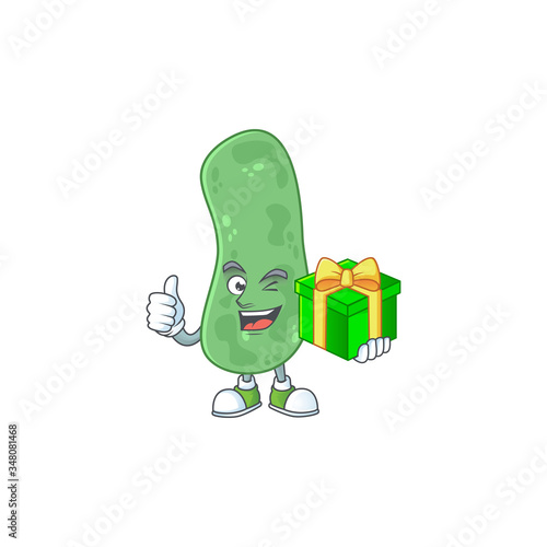 Smiley enterobacteriaceae cartoon character holding a gift box