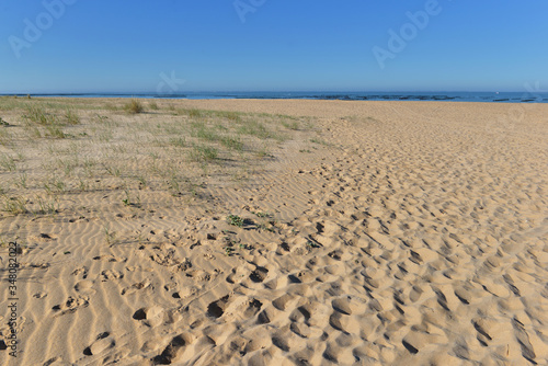view on sandy beach of Atlantic Ocean in France under bleu sky
