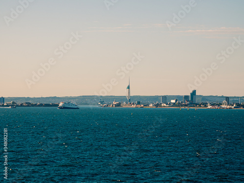 Panoramic view on the buildings of Portsmouth from the cruise ship in ocean © STUDIO MELANGE