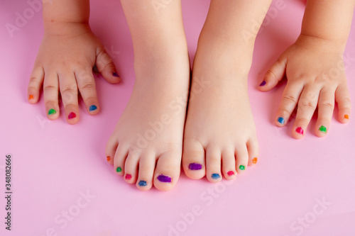 Manicured girl s nails on fingers and toes. Flat lay