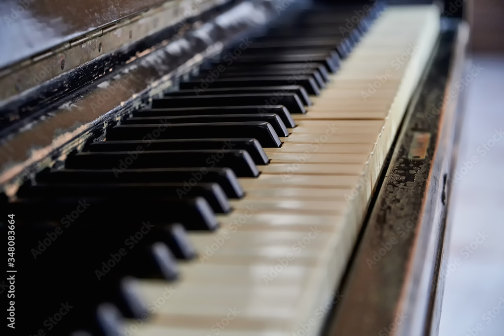 Keys of an old piano, Grand piano close-up. Piano keys with low depth of field. Keys of an old piano, Grand piano close-up. Piano keys with low depth of field.