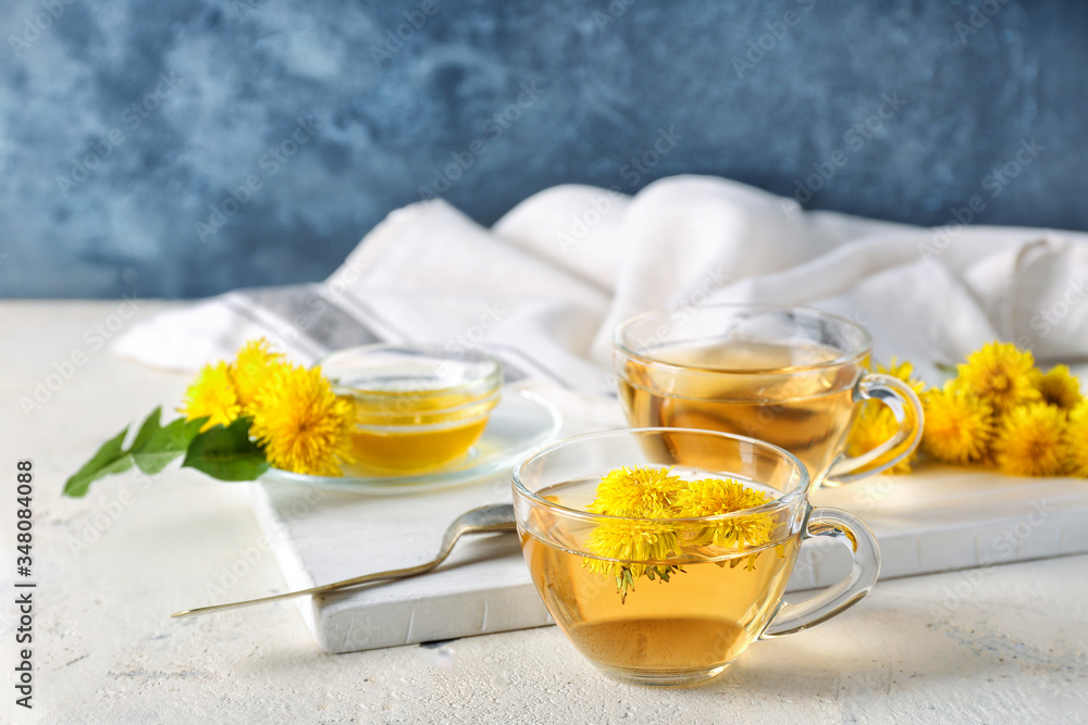 Healthy dandelion tea with honey on table Healthy dandelion tea with honey on table