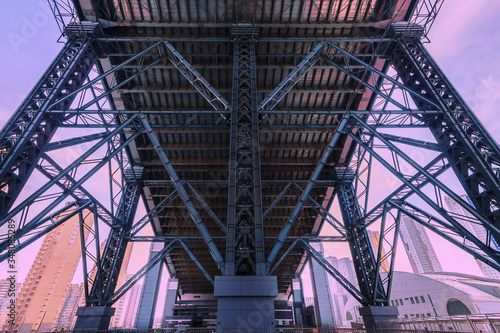 close up steel construction from under the bridge blue violet sky abstract technology background,