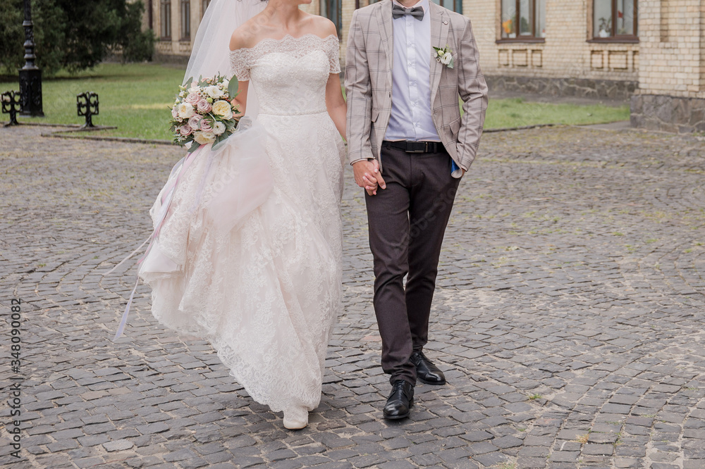 Obraz premium bride and groom in summer park together