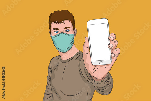 Portrait of man with medical mask holding smartphone. photo