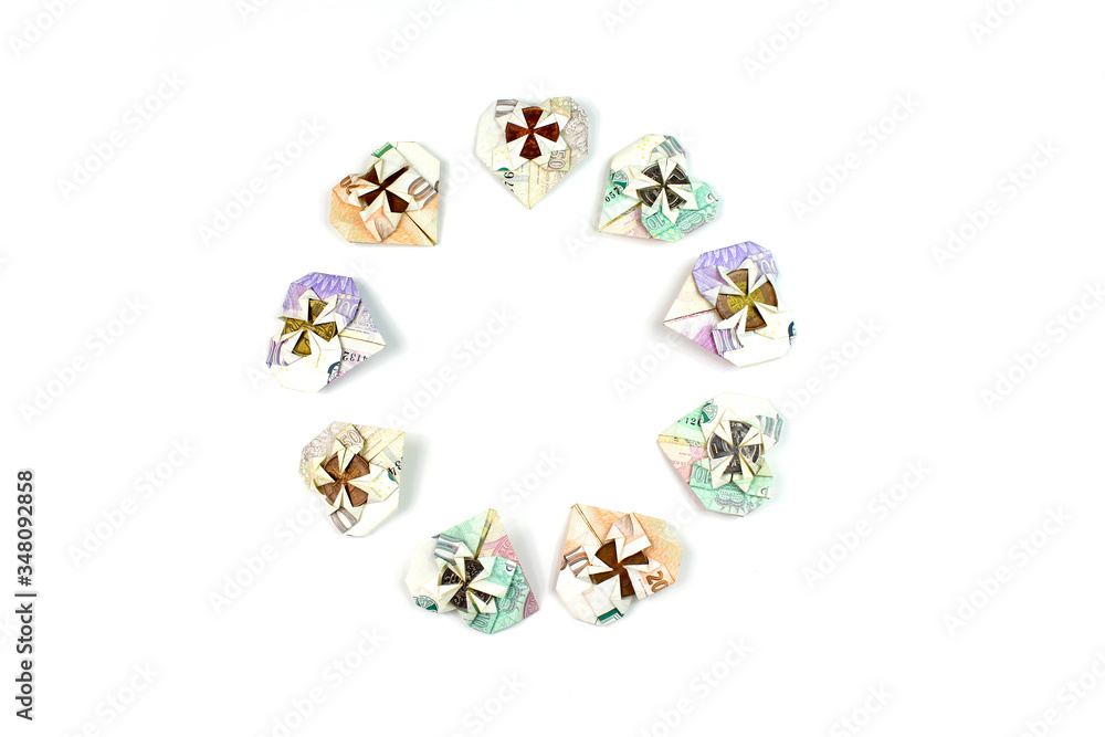 Czech money folded in heart shape isolated on white background in circle Czech money folded in heart shape isolated on white background in circle