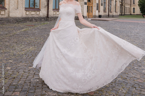 bride with a bouquet of flowers in the park