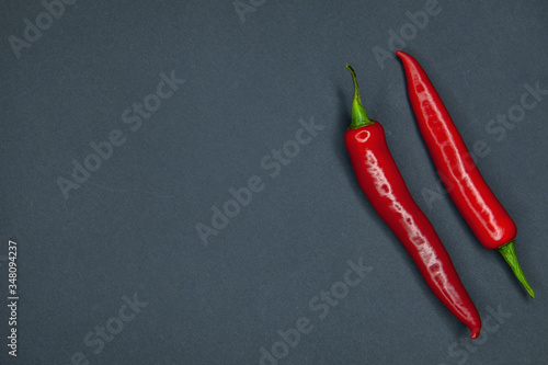Red hot chili peppers on a dark background