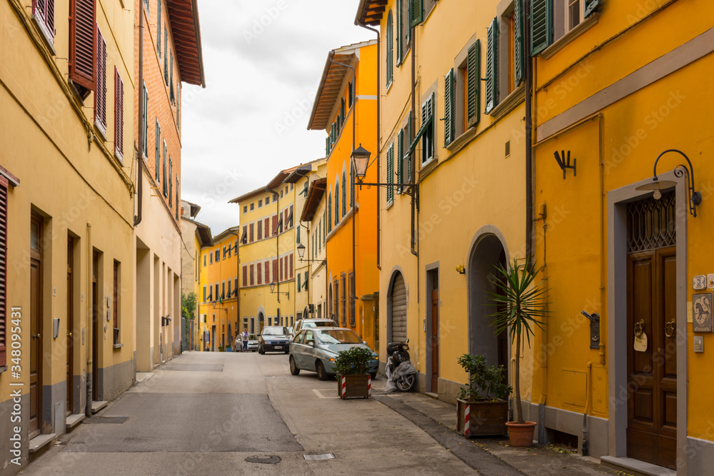 Old buildings on a narrow street in the historical center of San Miniato