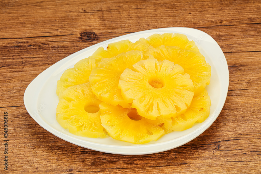 Marinated pineapple rings in the bowl Marinated pineapple rings in the bowl