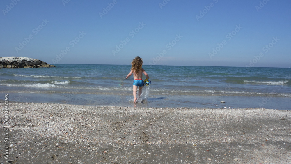 Kid playing on the beach