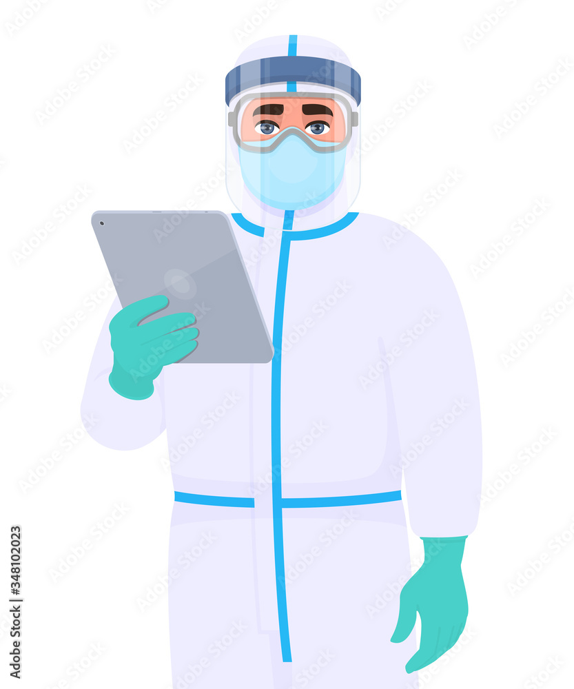 Doctor in safety protection suit uniform, mask, glasses and face shield holding tablet computer. Physician or surgeon showing PC notebook. Person wearing personal protective equipment dress (PPE).