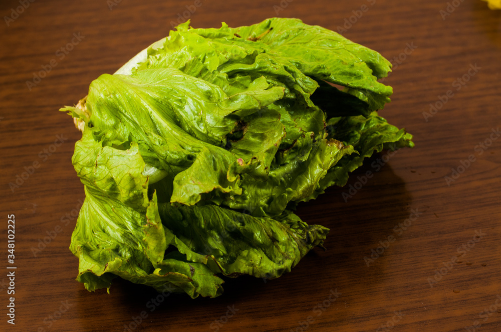 Lettuce on a wooden table. Healthy food Lettuce on a wooden table. Healthy food