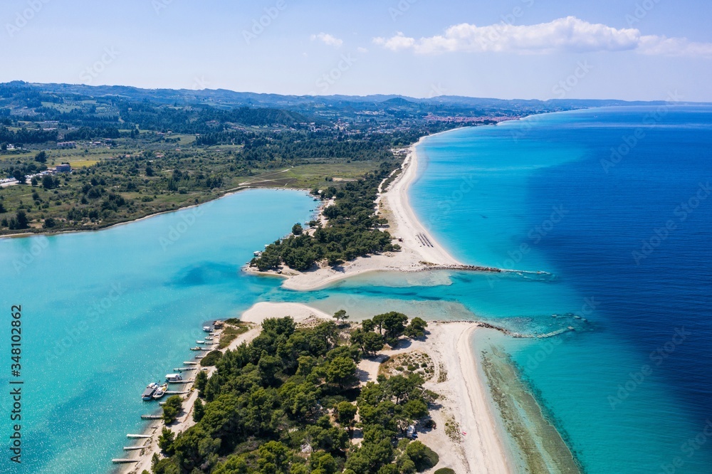 Aerial drone view of Port Glarokavos and lagoon beach in Kassandra penisula Chalkidiki Greece