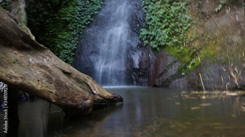 beautiful waterfall in the middle of the forest in central java  indonesia