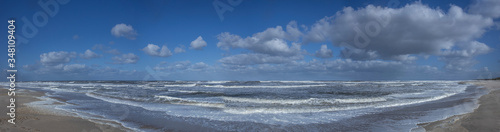 Northsea coast Netherlands. Julianadorp. Beach. Breaking waves. Clouds Panorama. Sea.