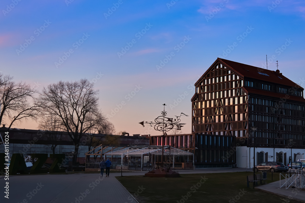 Beautiful sunset over port area and typical fachwerk building in spring in Klaipeda, Lithuania