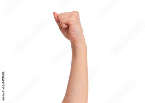 Female hand with fingers folded into fist, isolated on white background. Beautiful hand of woman with copy space.