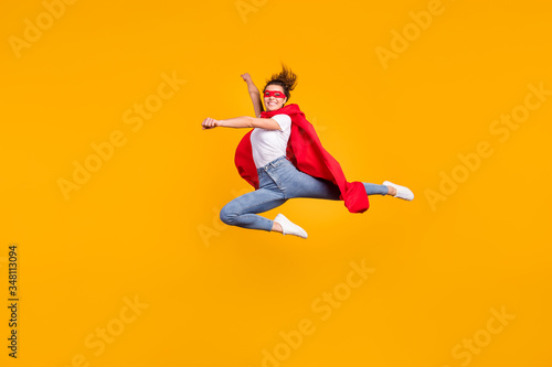 Full length body size view of her she nice attractive lovely fit slim cheerful cheery girl jumping wearing cape rescuing planet isolated on bright vivid shine vibrant yellow color background