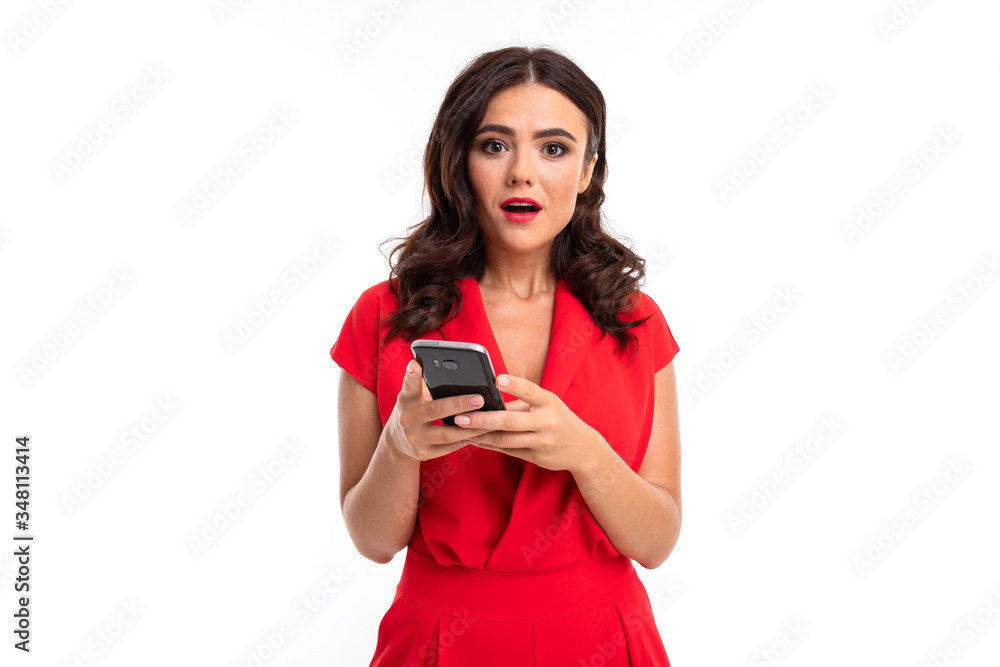 Portrait of nice caucasian girl serfing internet with her smartphone isolated on white background Portrait of nice caucasian girl serfing internet with her smartphone isolated on white background
