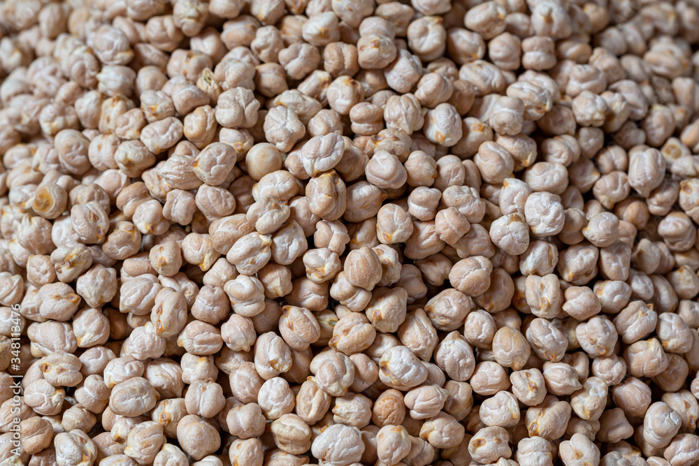 food background from a texture of raw chickpeas close-up. food background from a texture of raw chickpeas close-up.