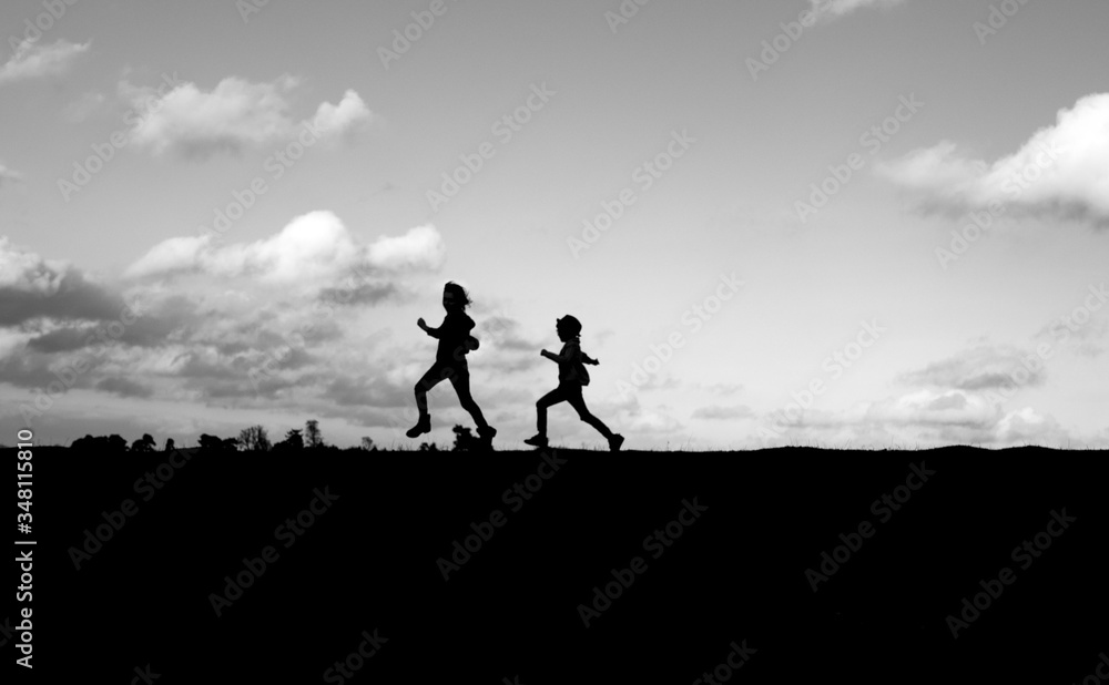 Children running silhouette