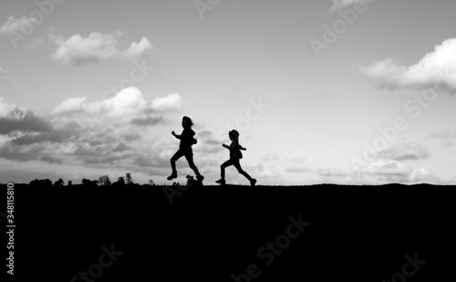 Children running silhouette