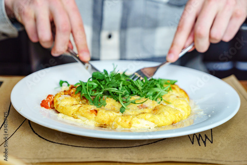 omelet with cherry tomatoes and arugula