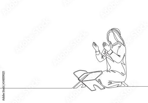 One continuous line drawing of young muslim person raise and open hands praying behind quran. Islamic holy day Ramadan Kareem and Eid Mubarak pray concept single line draw design vector illustration