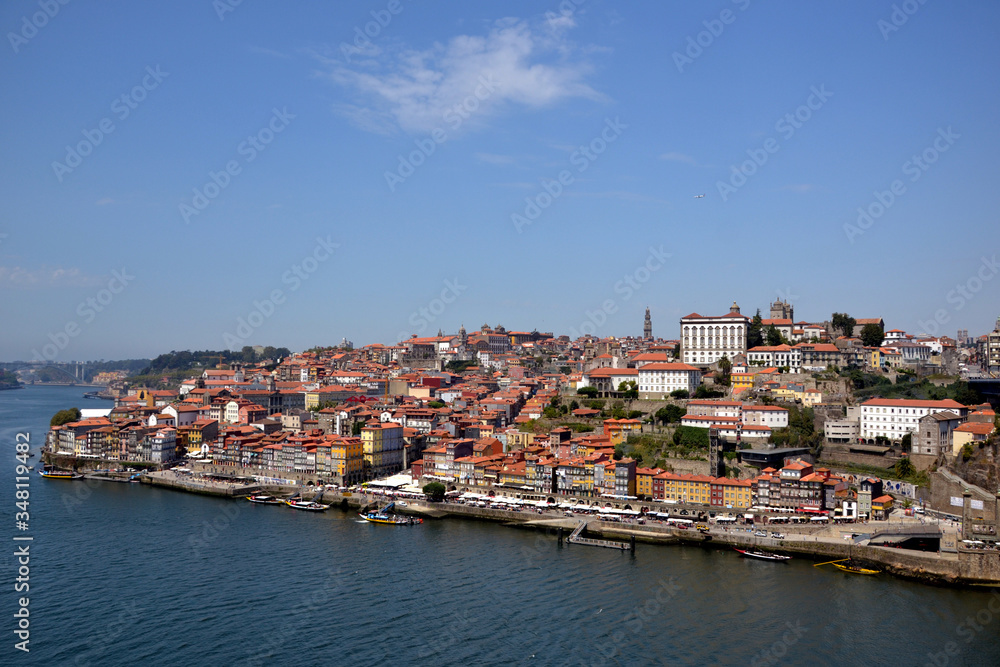 Porto, Portugal - August 20, 2015: Cityscape of Porto in summer, with a good weather. This city is built along the river Douro, which goes to the sea.
